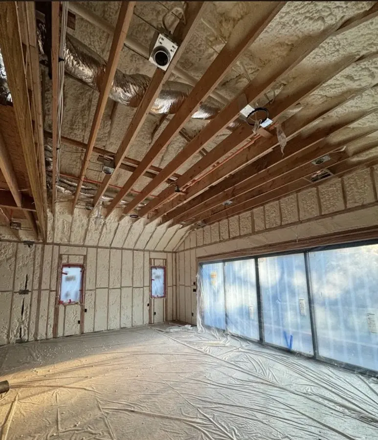 Interior walls and ceiling insulated with spray foam during new construction in Charlestown